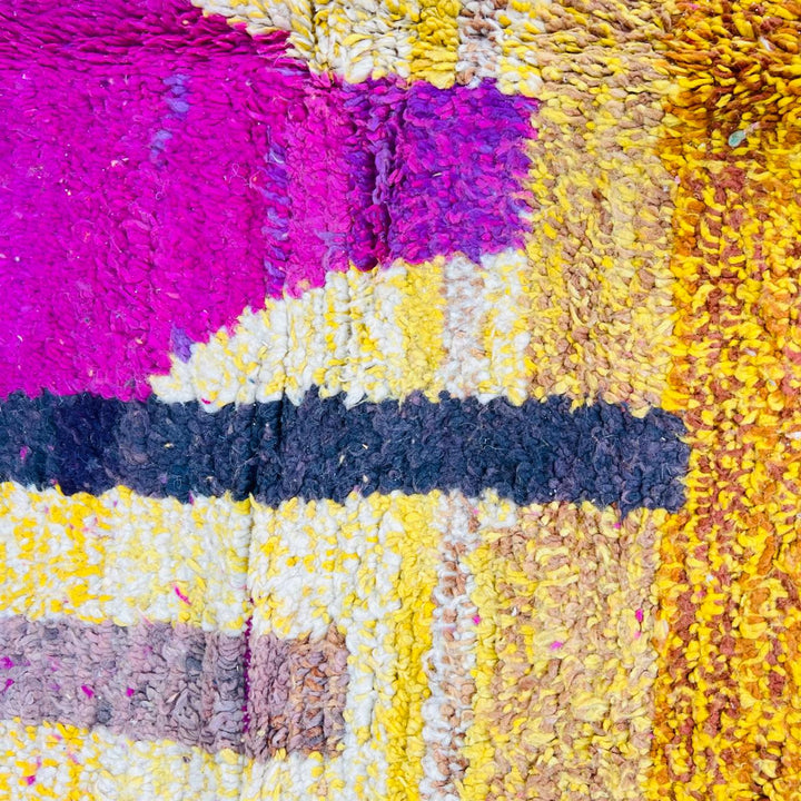 Handmade vintage Moroccan wool rug in pink and yellow with abstract Berber design. One-of-a-kind artisan rug, 255×166 cm.
