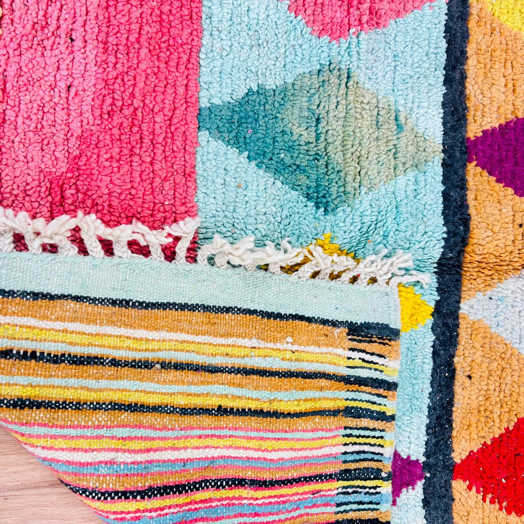 Handmade vintage Moroccan wool rug with colorful geometric Berber design. One-of-a-kind artisan rug, 290×155 cm.