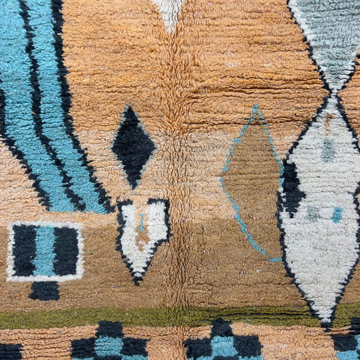 Vintage Moroccan wool rug with abstract geometric patterns in beige, mustard, and turquoise tones, handmade Berber carpet