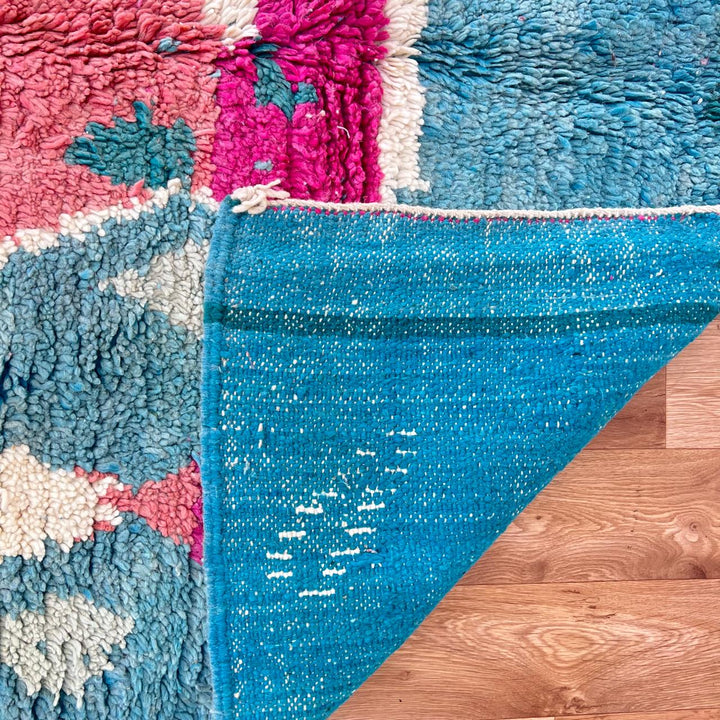 Vintage Moroccan wool rug in turquoise and pink tones with tribal Berber patterns, handmade in Morocco
