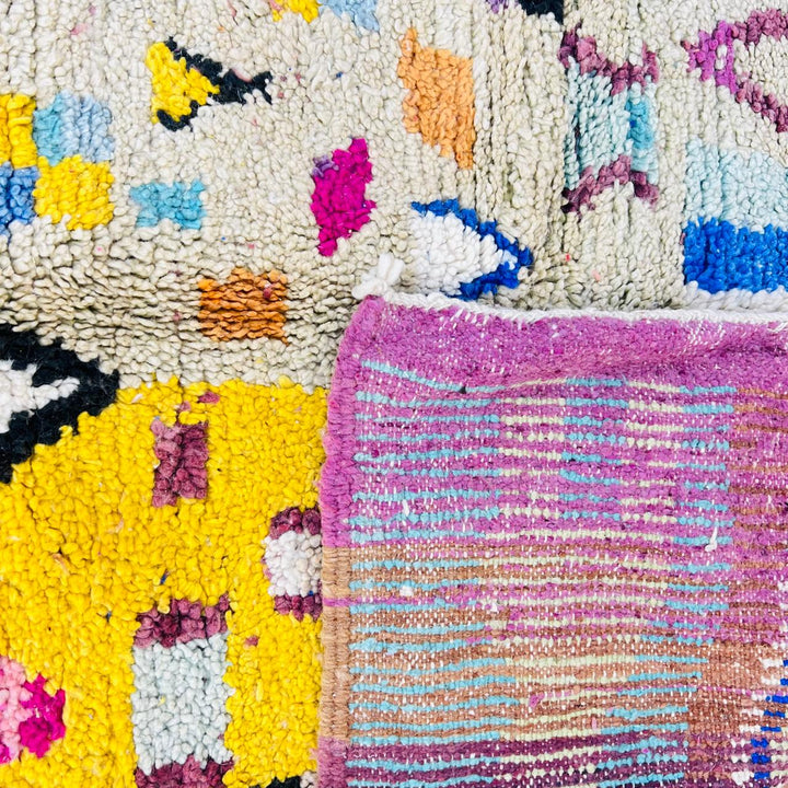 Vintage Moroccan wool rug with colorful geometric Berber pattern, handmade in Morocco