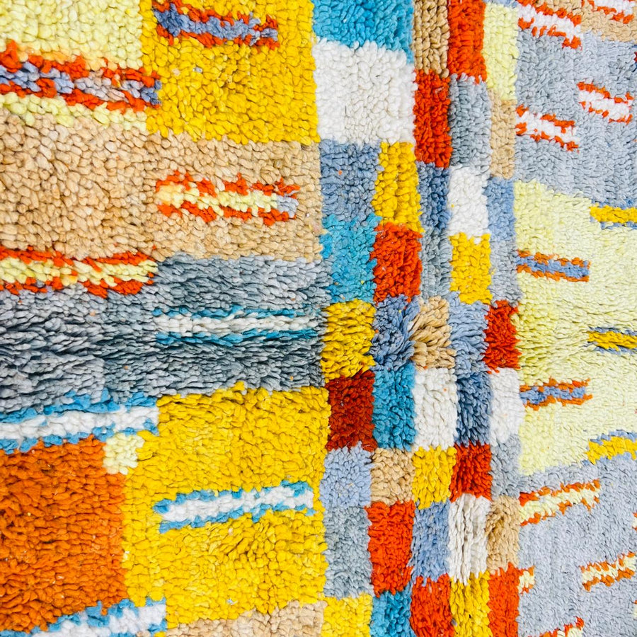 Vintage Moroccan wool rug with geometric patterns in yellow, grey, teal and orange – handmade Berber rug from Morocco