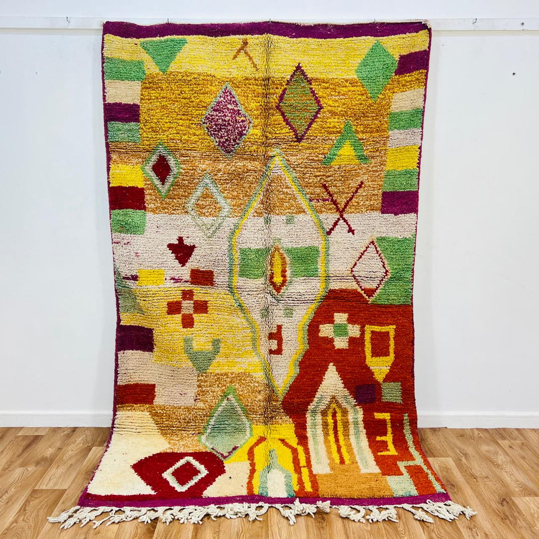 Vintage Moroccan wool rug with colorful Berber geometric symbols, handmade in Morocco