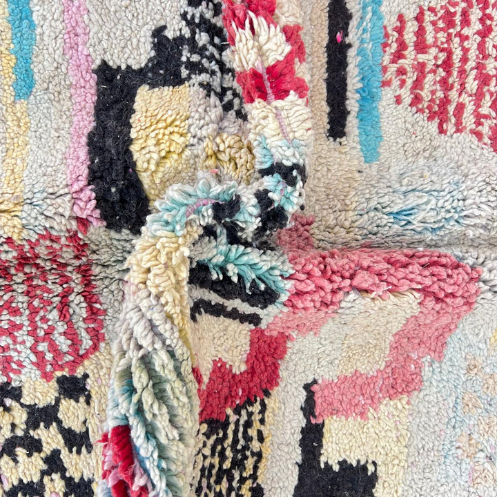 Vintage Moroccan wool rug with colorful patchwork Berber patterns, handmade in Morocco
