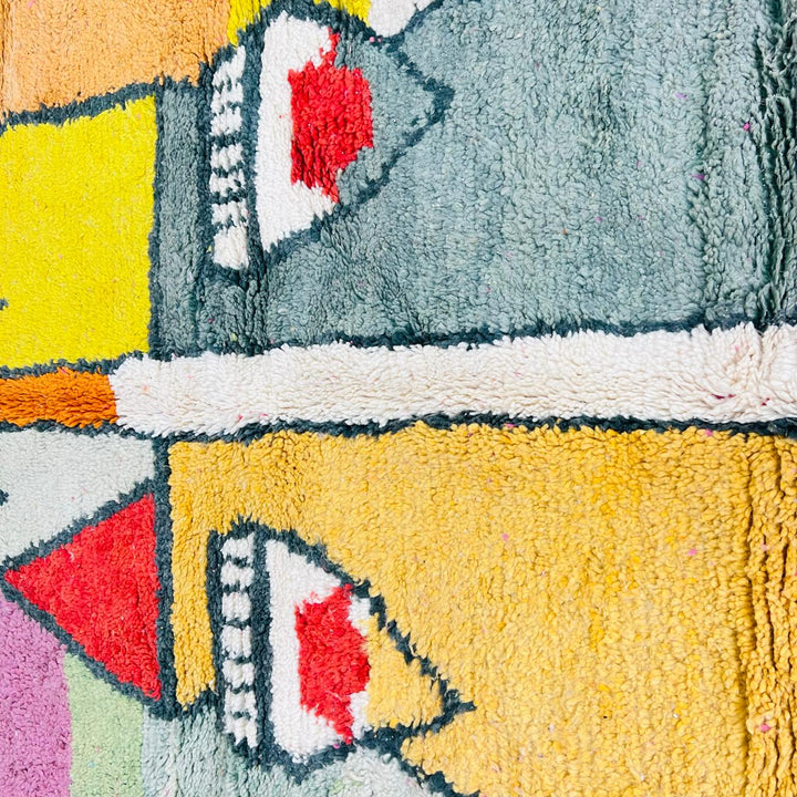 Vintage Moroccan wool rug with colorful geometric Berber pattern in pink yellow green and cream – handmade in Morocco
