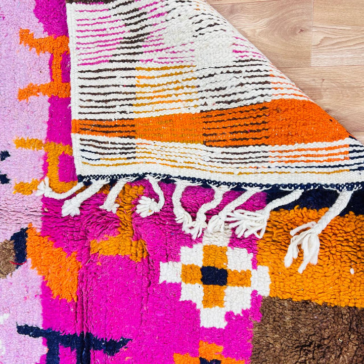 Vintage Moroccan wool rug with colorful Berber tribal symbols, handmade in Morocco