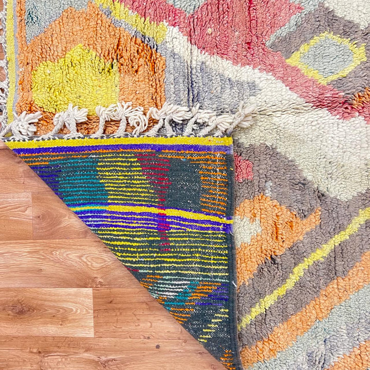 Vintage Moroccan wool rug with abstract Berber pattern in earthy tones, handmade in Morocco