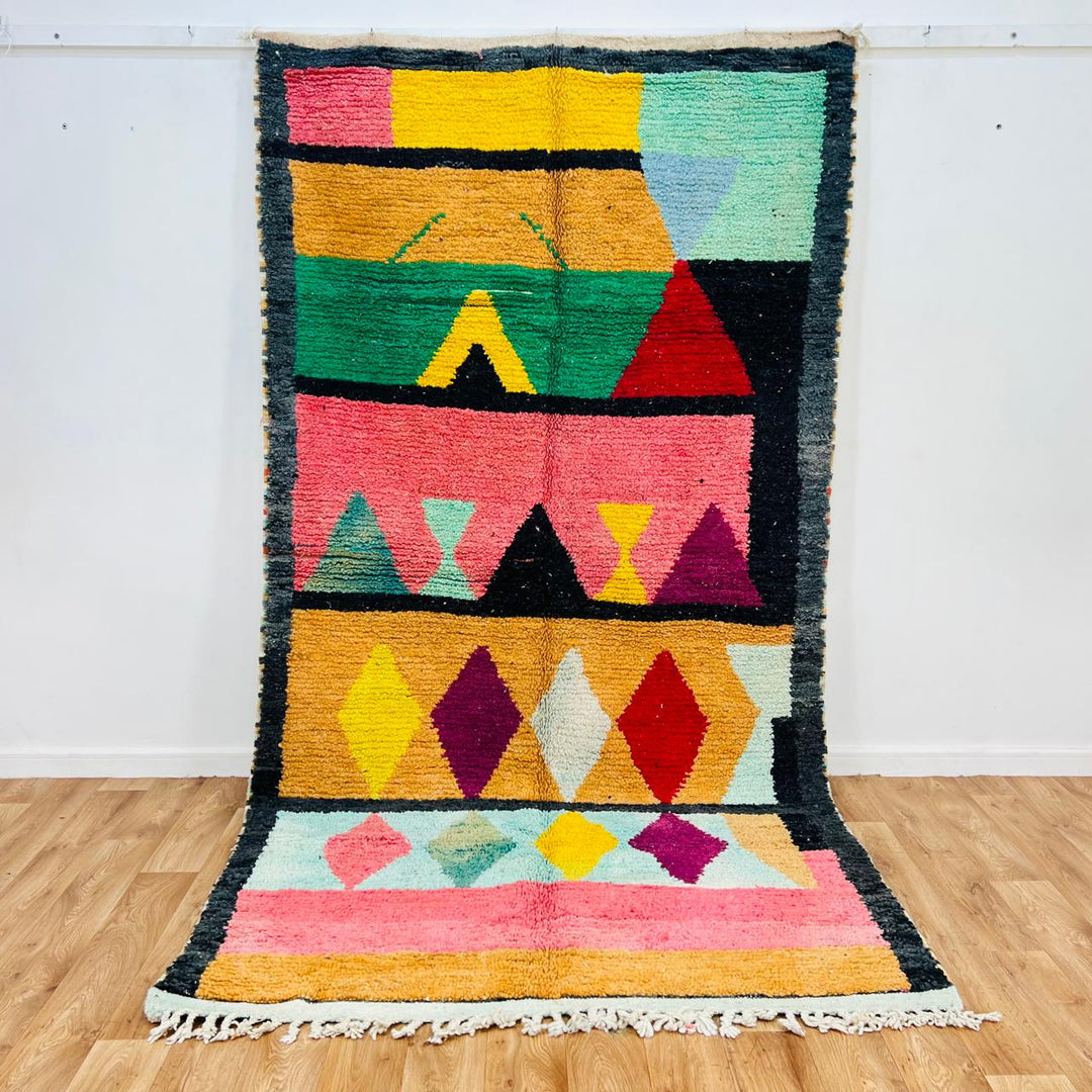 Handmade vintage Moroccan wool rug with colorful geometric Berber design. One-of-a-kind artisan rug, 290×155 cm.
