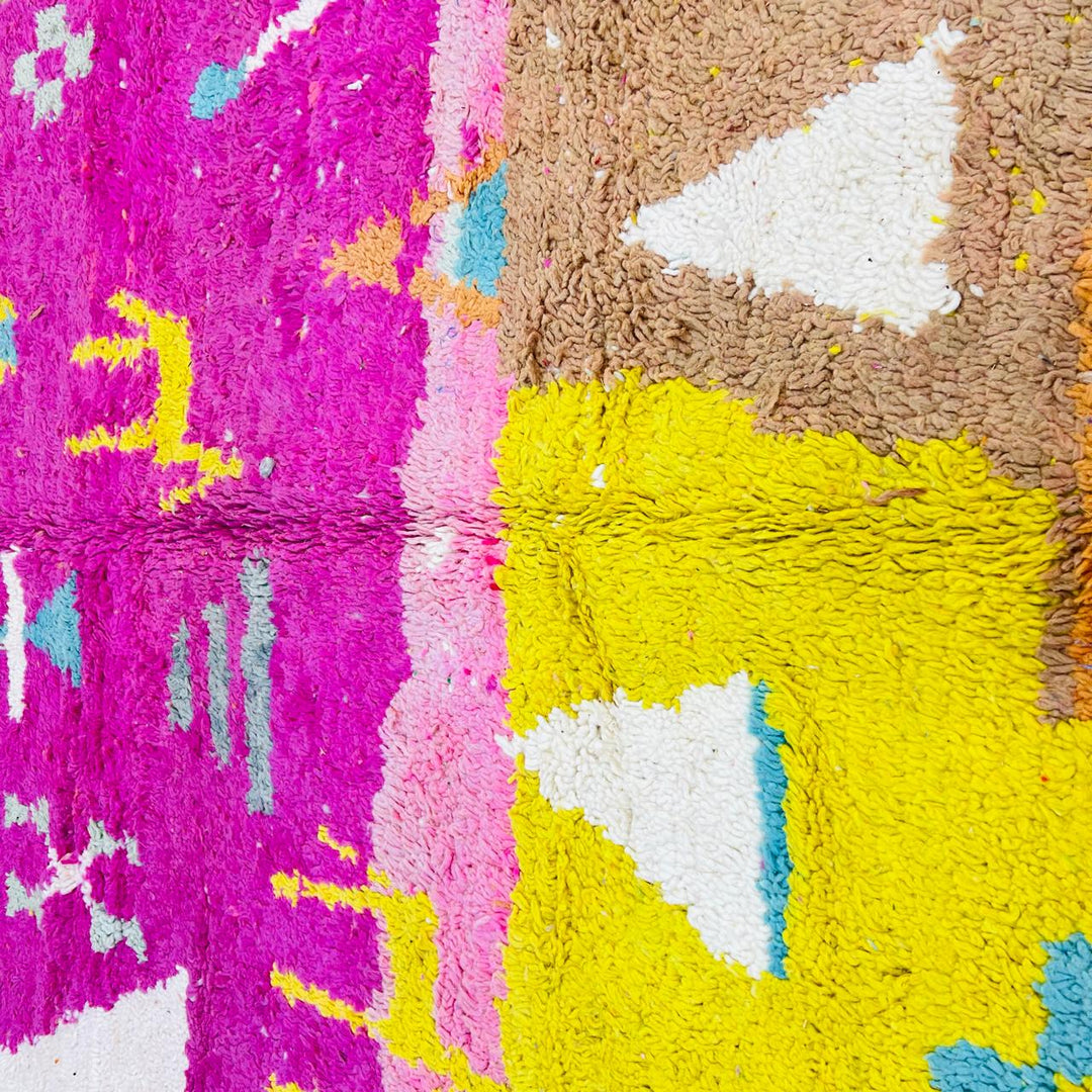Vintage Moroccan wool rug with pink Berber tribal symbols, handmade in Morocco