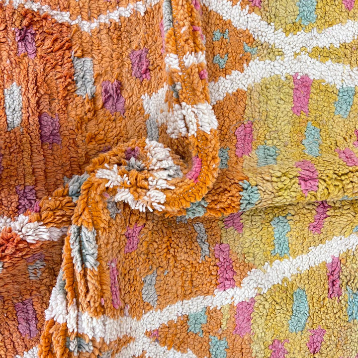 Vintage Moroccan wool rug in orange tones with white Berber diamond patterns, handmade in Morocco