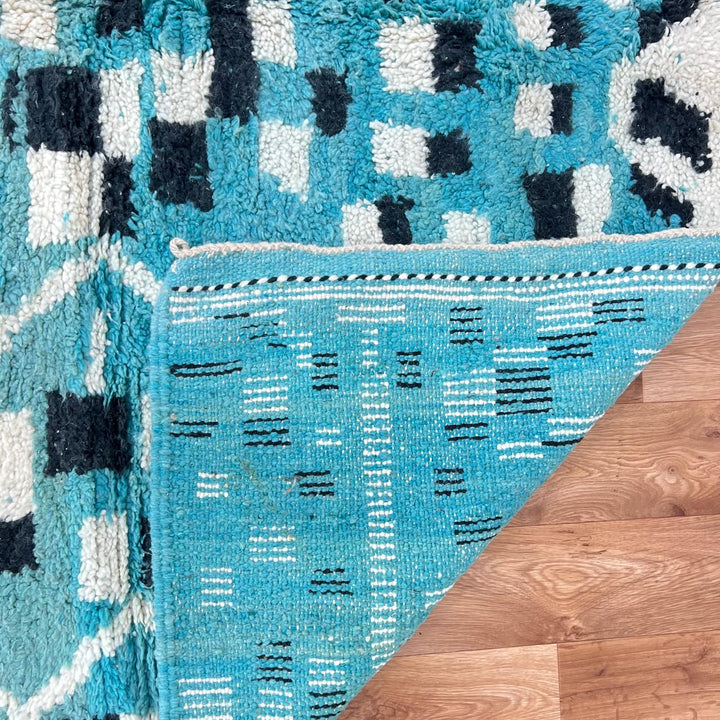 Vintage Moroccan wool rug in turquoise blue with black and ivory Berber geometric patterns