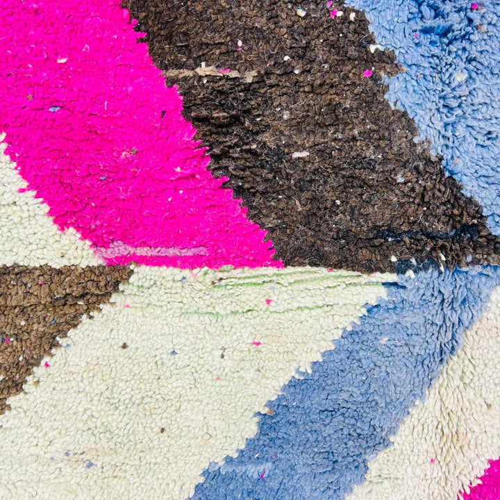 Vintage Moroccan wool rug with abstract Berber geometric pattern in pink, ivory, blue, and black