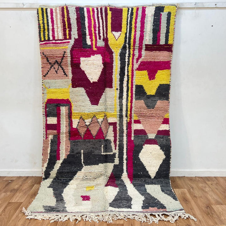 Vintage Moroccan wool rug with colorful abstract Berber geometric design in burgundy, pink, yellow and grey tones