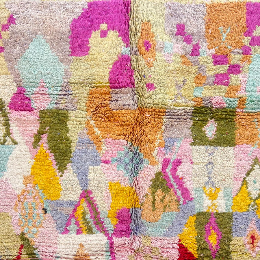 Vintage Moroccan wool rug with colorful Berber geometric patterns, handmade in Morocco.