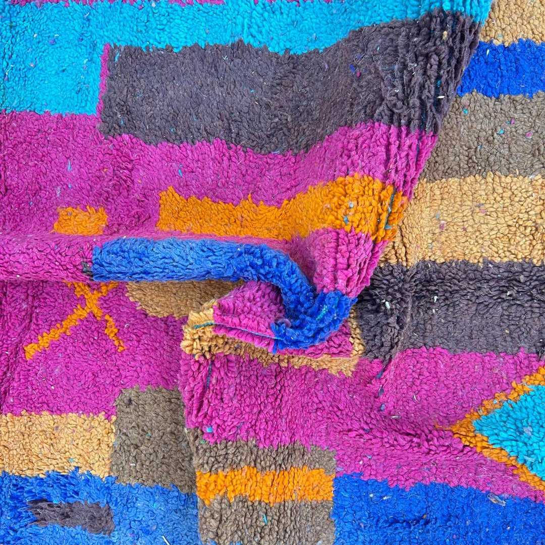 Vintage Moroccan wool rug with colorful Berber geometric patterns in pink, blue, and orange
