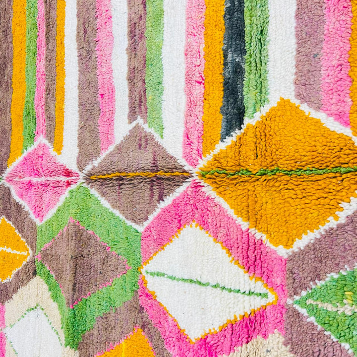Vintage Moroccan wool rug with colorful Berber diamond and stripe patterns in pink, green and mustard