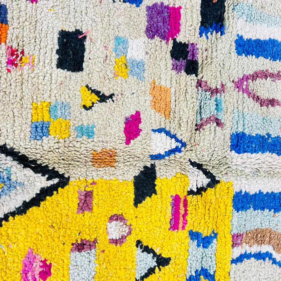 Vintage Moroccan wool rug with colorful geometric Berber pattern, handmade in Morocco