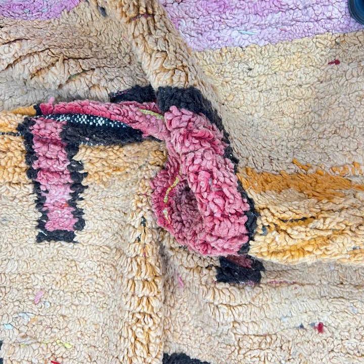 Vintage Moroccan wool rug with pink tones and abstract Berber symbols, handmade in Morocco