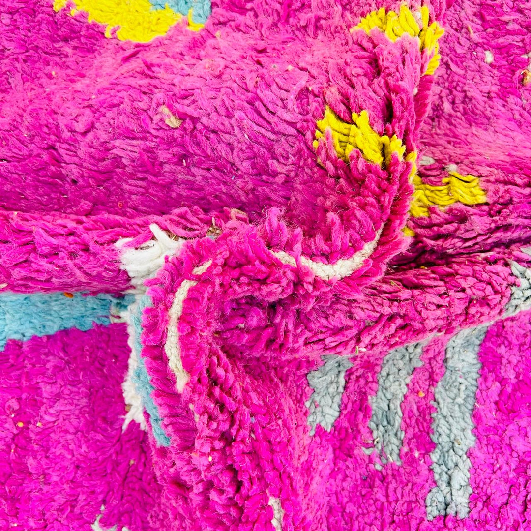 Vintage Moroccan wool rug with pink Berber tribal symbols, handmade in Morocco