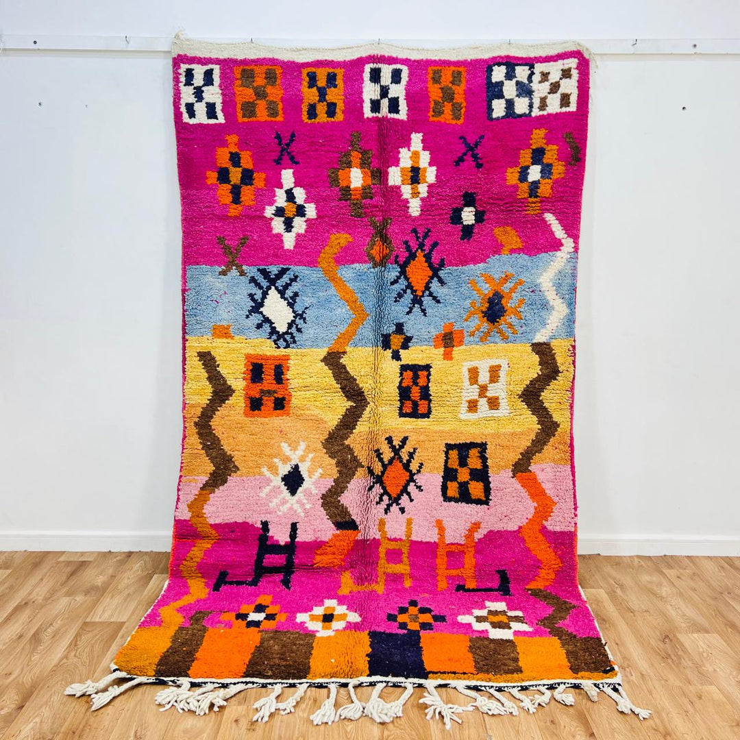 Vintage Moroccan wool rug with colorful Berber tribal symbols, handmade in Morocco