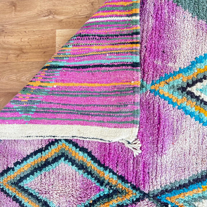 Vintage Moroccan wool rug with purple background and colorful diamond Berber patterns, handmade in Morocco