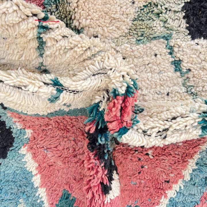 Vintage Moroccan wool rug in turquoise and pink tones with tribal Berber patterns, handmade in Morocco