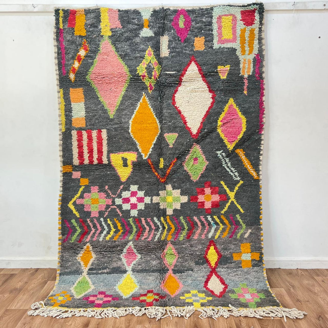 Vintage Moroccan wool rug with colorful Berber geometric pattern on gray background, handmade in Morocco, size 228 x 155 cm.