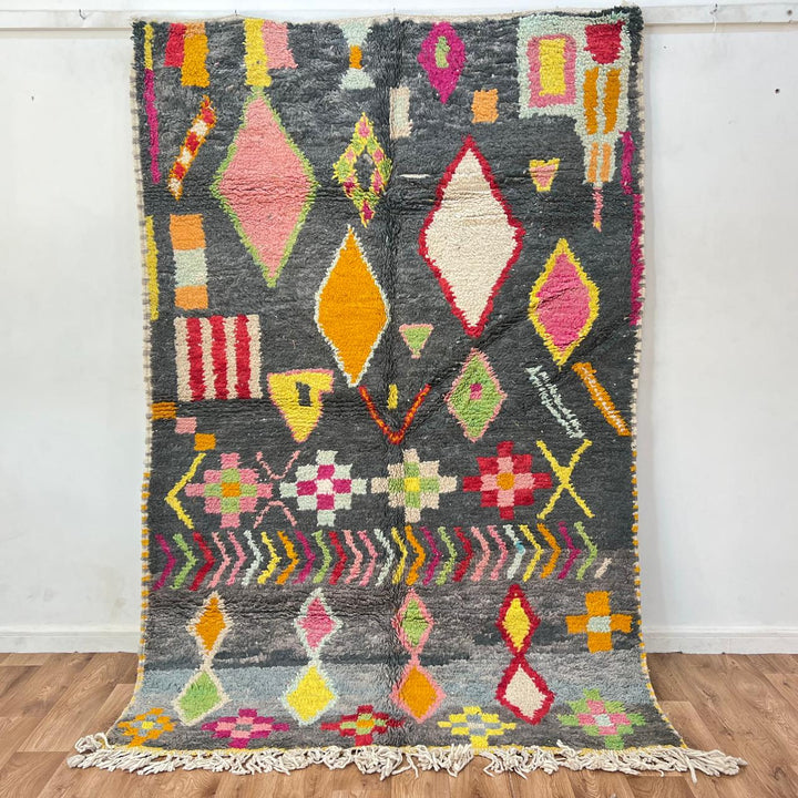 Vintage Moroccan wool rug with colorful Berber geometric pattern on gray background, handmade in Morocco, size 228 x 155 cm.