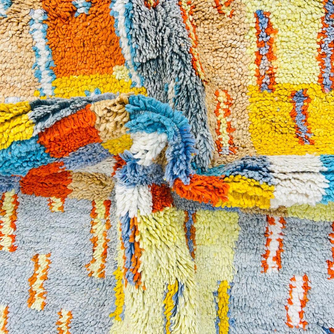 Vintage Moroccan wool rug with geometric patterns in yellow, grey, teal and orange – handmade Berber rug from Morocco
