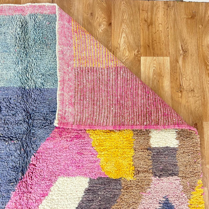 Vintage Moroccan Wool Rug 192 – handmade pink, yellow, and brown abstract Moroccan wool rug (241 × 157 cm).