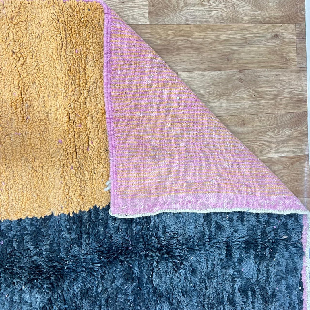 Vintage Moroccan Wool Rug 132 – handmade pink, yellow, and blue abstract Moroccan wool rug (255 × 150 cm).