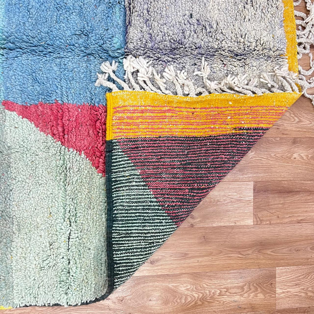 Vintage Moroccan Wool Rug 132 – handmade pink, yellow, and blue abstract Moroccan wool rug (255 × 150 cm).
