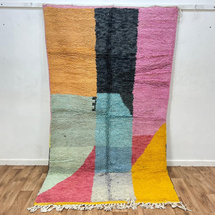Vintage Moroccan Wool Rug 132 – handmade pink, yellow, and blue abstract Moroccan wool rug (255 × 150 cm).