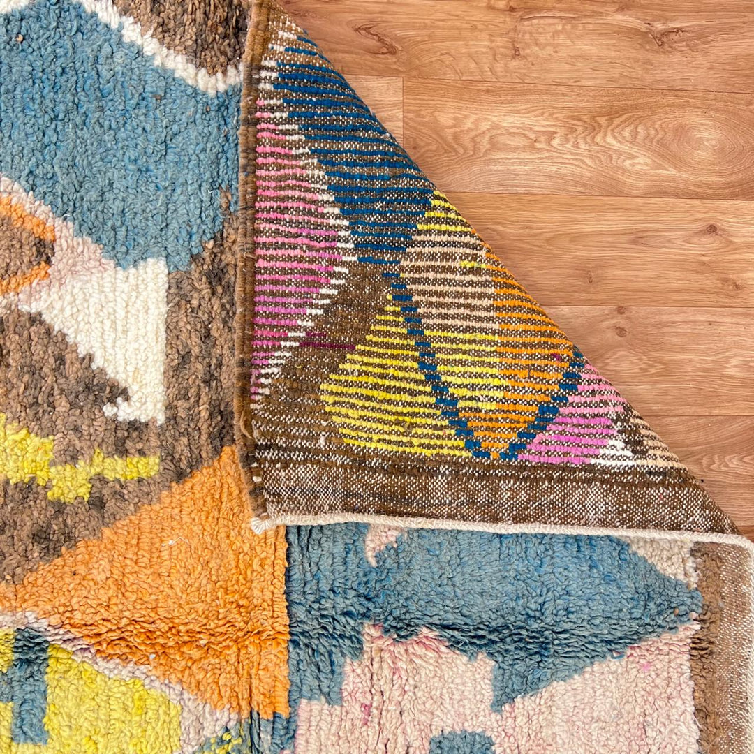 Vintage Moroccan Wool Rug 217 – handmade tribal geometric wool rug in blue, mustard, and orange tones (247 × 153 cm).