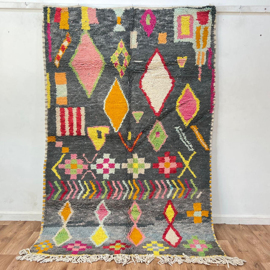 Vintage Moroccan wool rug with colorful Berber geometric pattern on gray background, handmade in Morocco, size 228 x 155 cm.