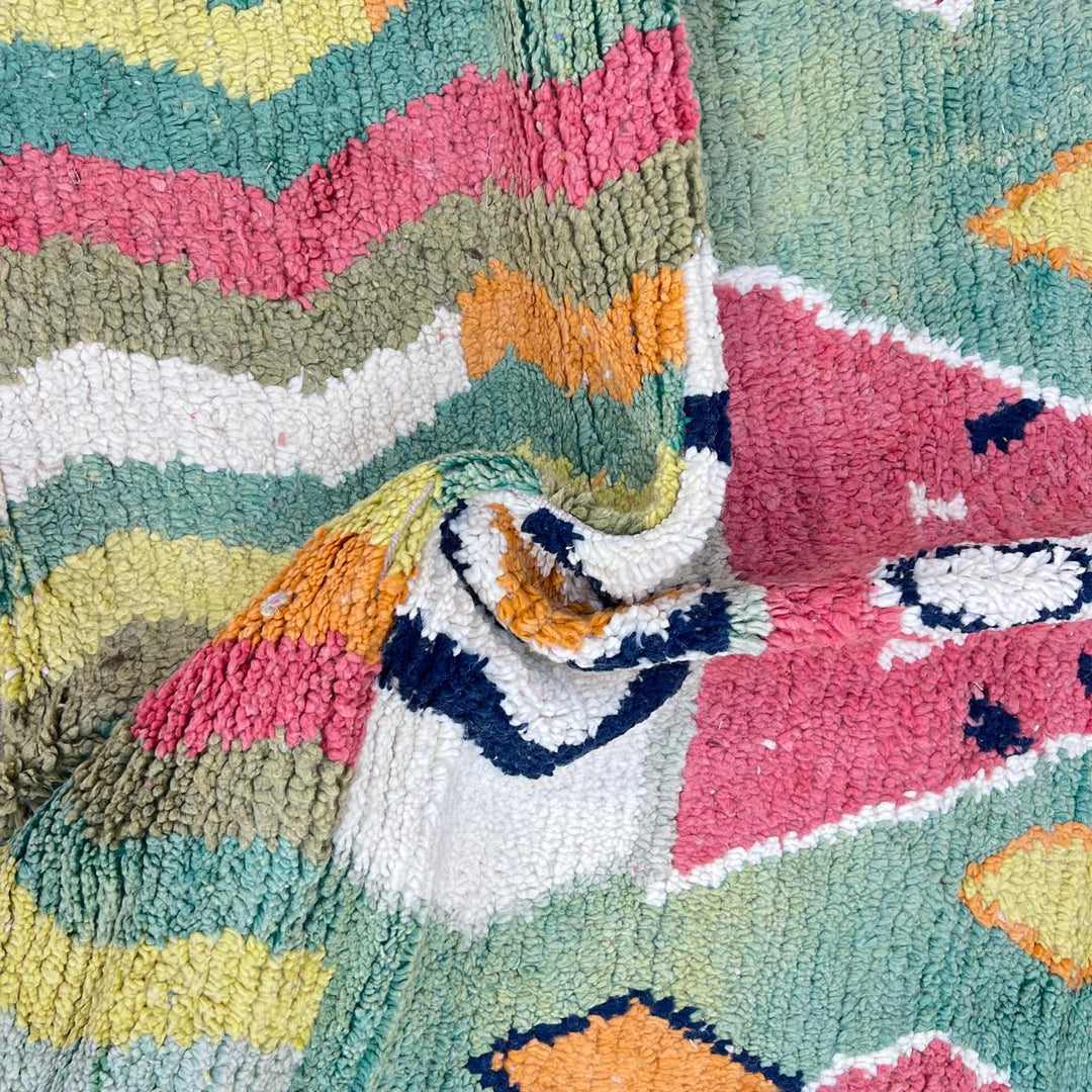 Vintage green Moroccan Berber rug with zigzag stripes and central diamond motif, handmade wool tribal area rug
