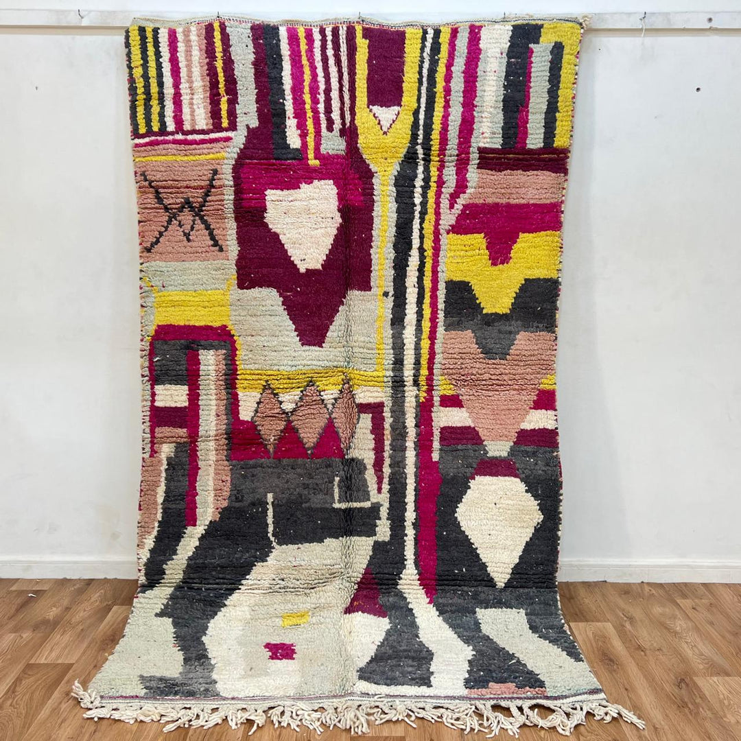 Vintage Moroccan wool rug with colorful abstract Berber geometric design in burgundy, pink, yellow and grey tones
