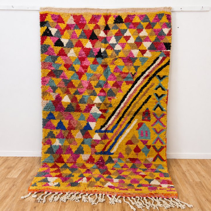 Vintage Moroccan wool rug 8.53x5.25 ft, handmade Berber rug with colorful triangle pattern and bold diagonal stripe design on yellow background