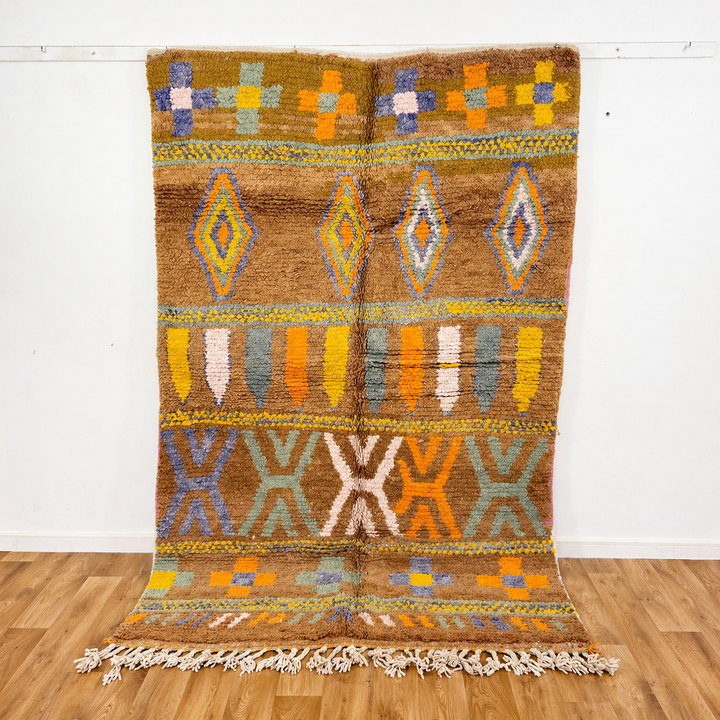 Vintage Moroccan wool rug with colorful Berber geometric patterns on brown background, handmade tribal carpet 8x5 ft
