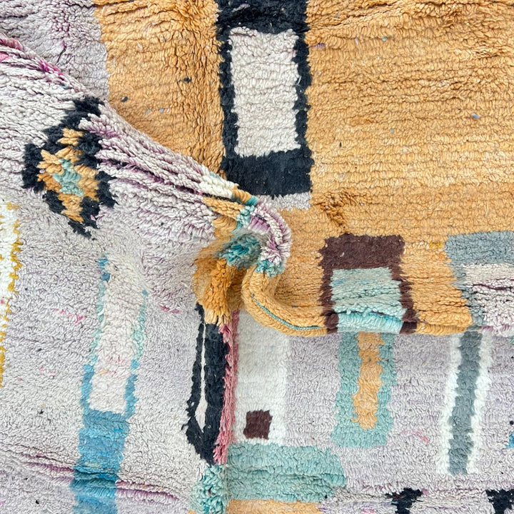Vintage Moroccan Berber rug with architectural abstract geometric design in ochre and pink wool