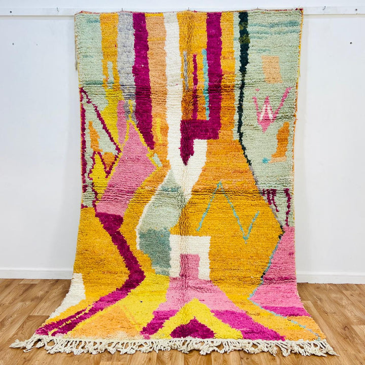 Colorful vintage Moroccan wool rug 712 handmade Berber design with orange, pink, and yellow geometric shapes.