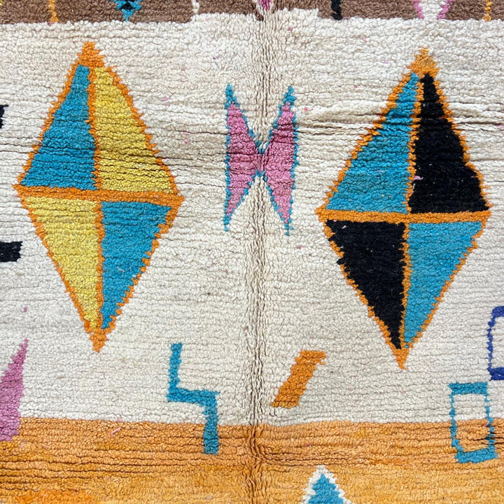 Vintage Moroccan wool rug 251 – handmade colorful geometric Berber rug with orange, turquoise, and yellow diamonds (252 × 150 cm).