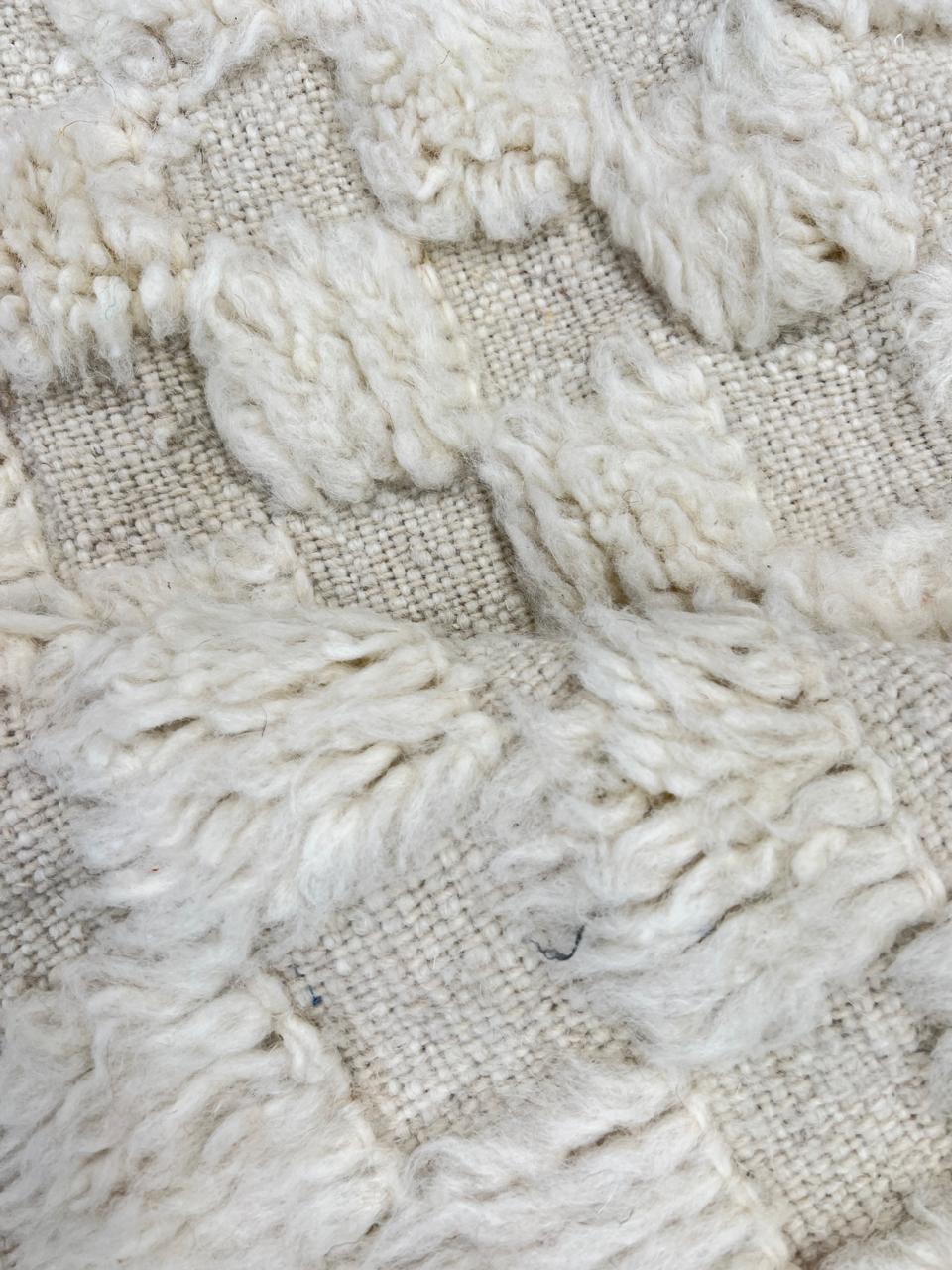 Handmade white Moroccan wool runner rug with subtle checkerboard pattern and fringe edges