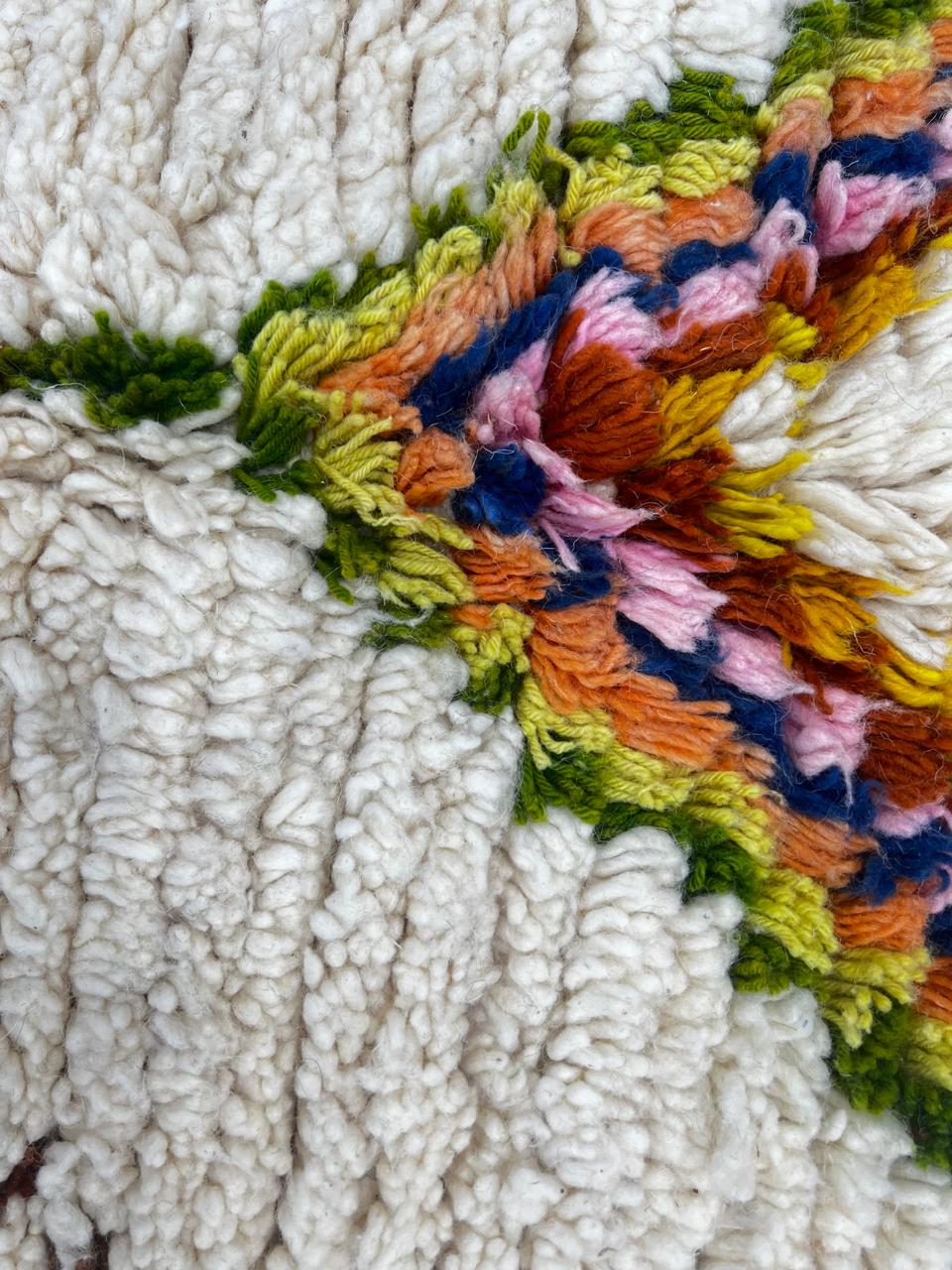 Handmade white Moroccan runner rug with colorful Berber diamond motifs and tribal patterns, crafted from natural wool for hallways and modern interiors.