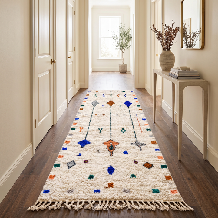 White Moroccan runner rug handmade from wool with colorful Berber symbols