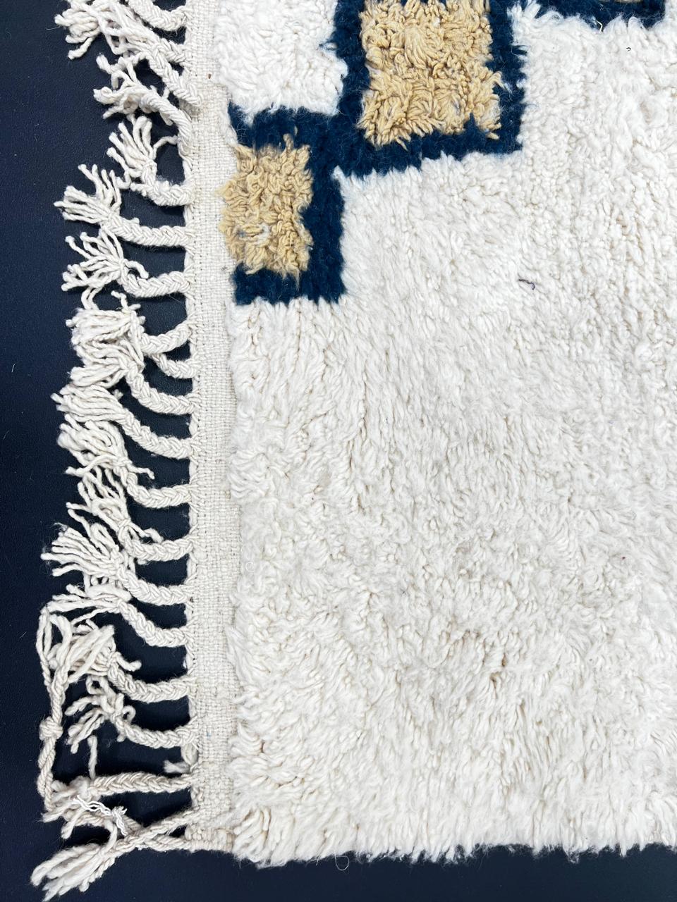 White Moroccan Berber runner rug with black and tan diamond motif, handmade wool hallway carpet with traditional tribal design