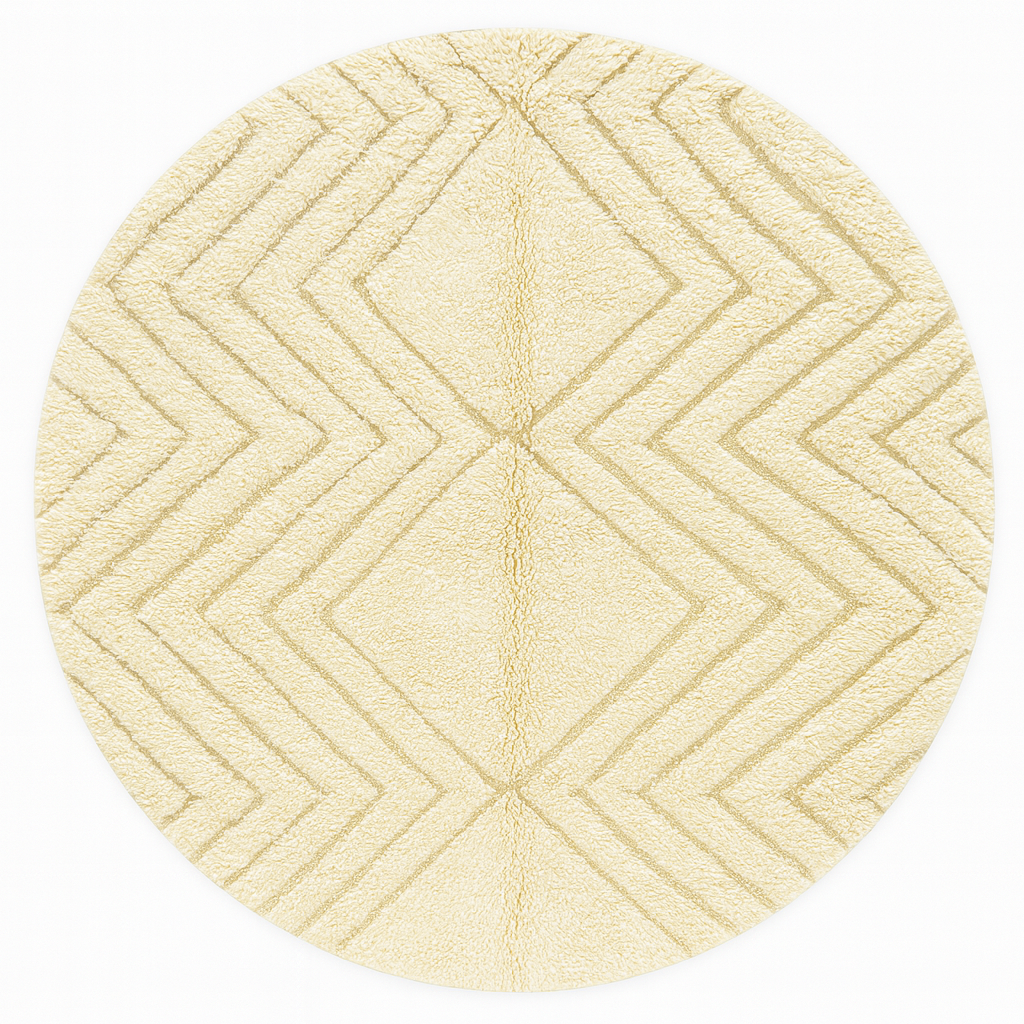 Round white Moroccan wool rug with carved geometric diamond and chevron patterns.