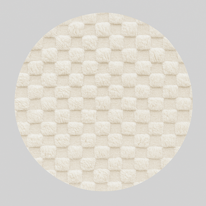 Round white Moroccan wool rug with raised checkered 3D texture.