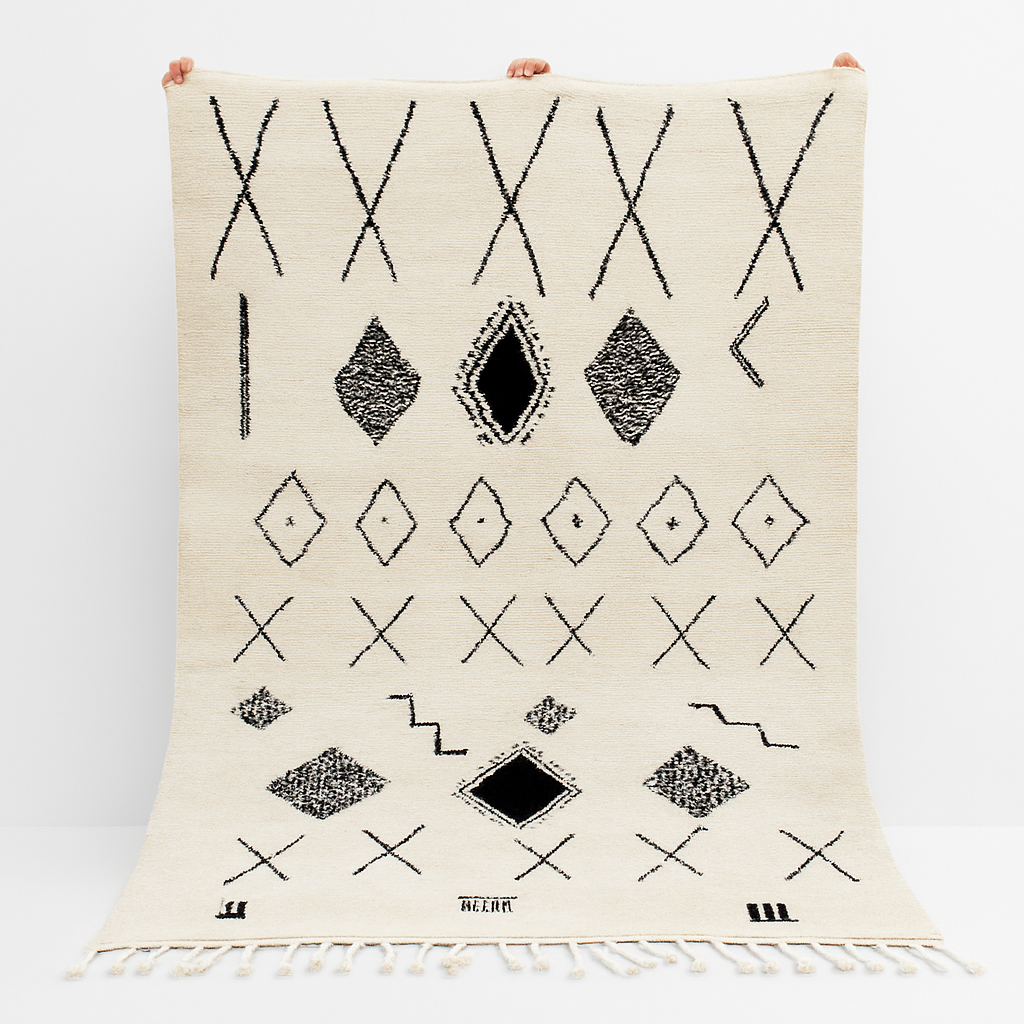 Handmade white Moroccan wool rug with black geometric motifs – Beni Ourain design