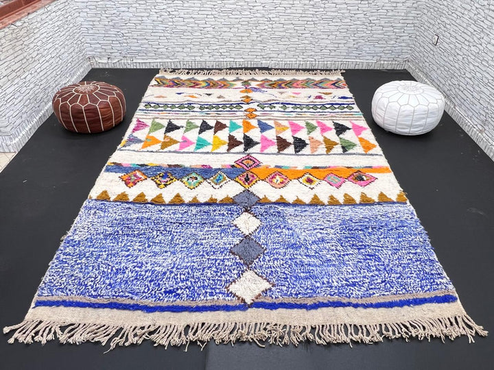 ivory and blue handmade moroccan berber rug with geometric tribal patterns in wool